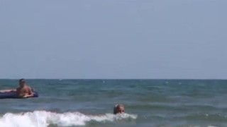 Blonde peeing public beach