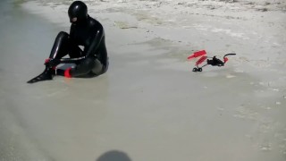 Latex Condom Catsuit at the Beach